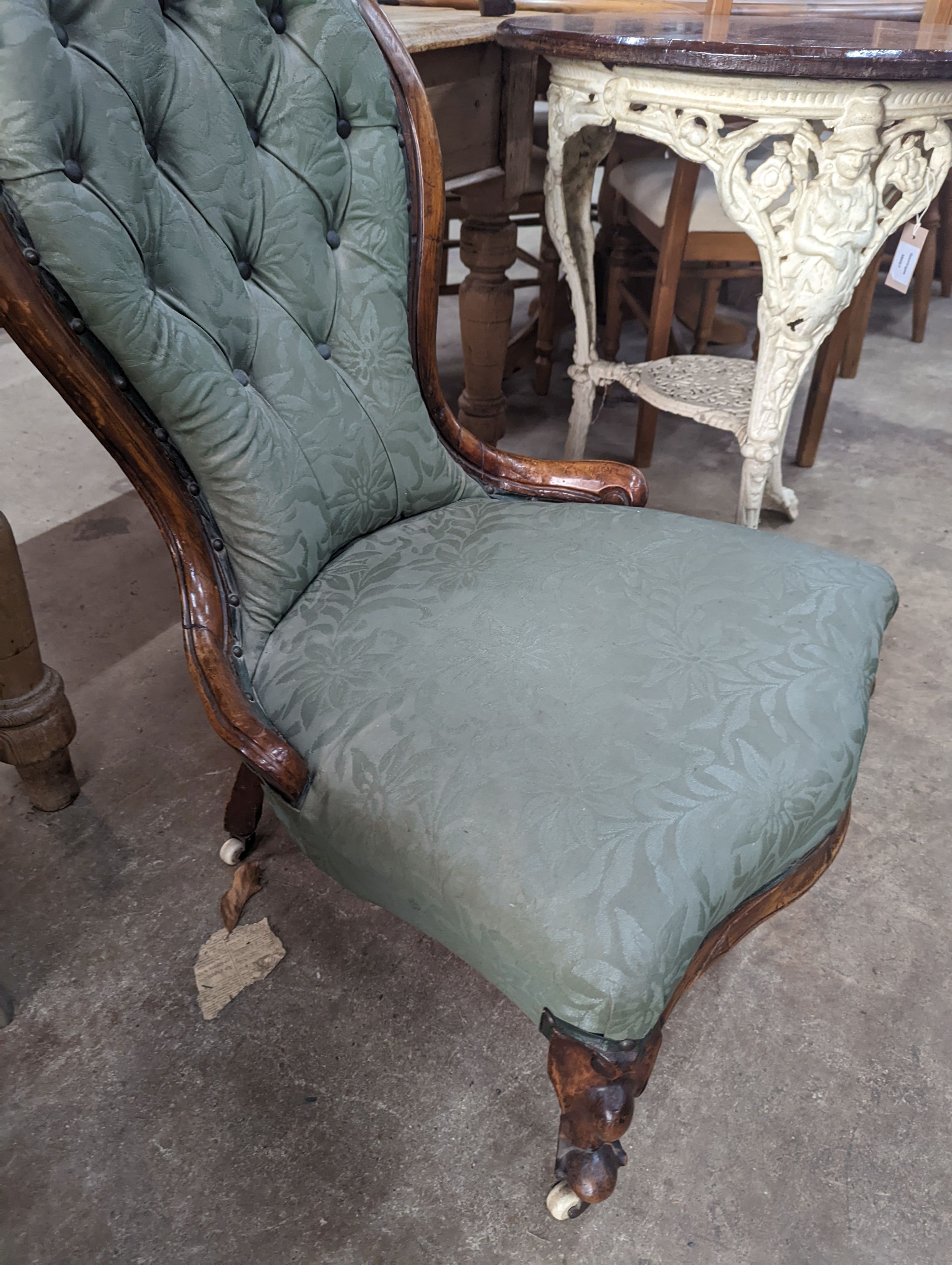 A Victorian walnut spoon back nursing chair